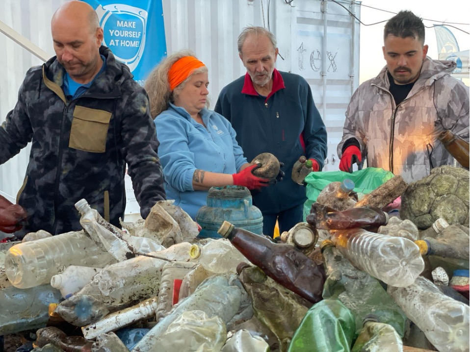 Sorting the collected waste. (Photo: Sára Bőhm / Plastic Cup)